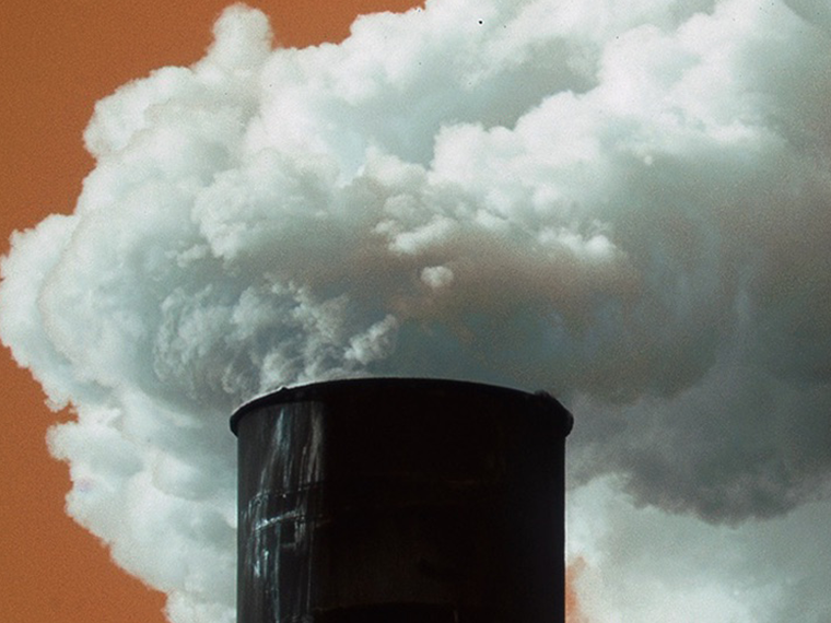 An industrial chimney emitting smoke