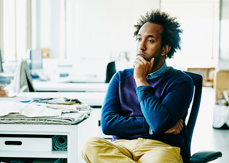 Man sits on a chair and ponders