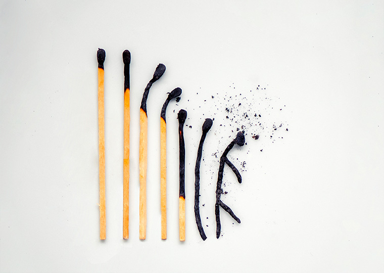 AN illustration of matches in various stages of burning until it reaches then end and what looks like a man made out of matches is entirely burned