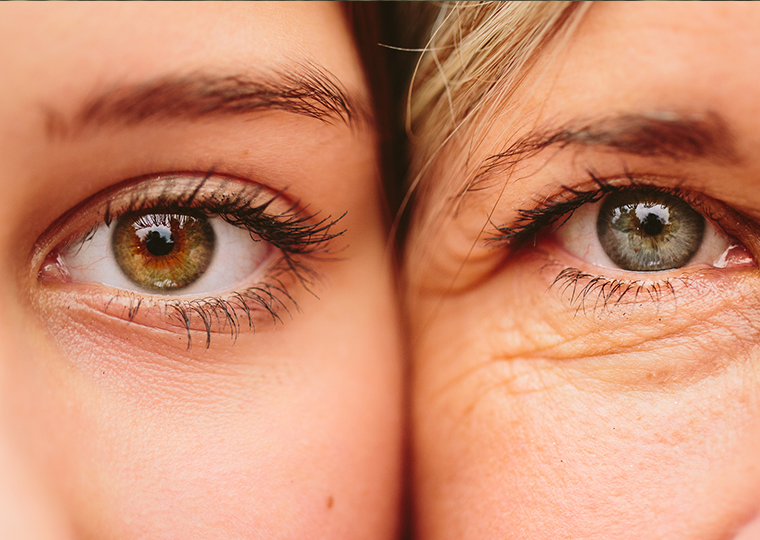 Close up on eyes of a younger woman and older woman next to one another