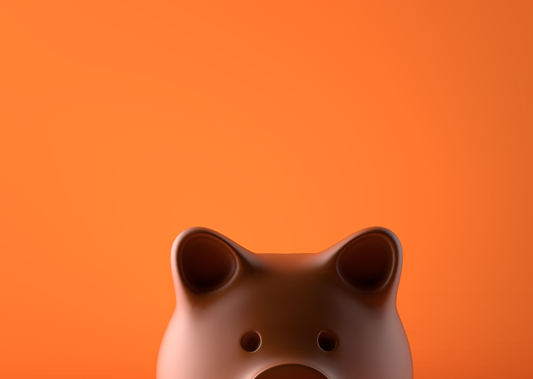 Piggy bank over orange background