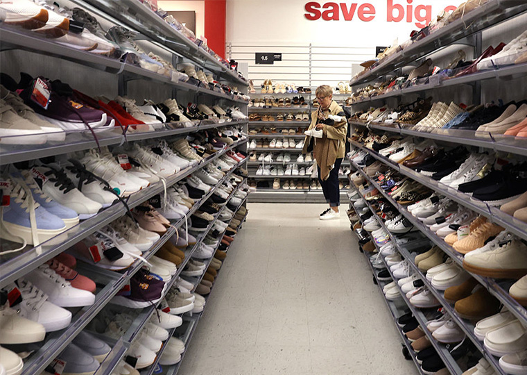 A woman shops in the shoe aisle at a department store in New York City