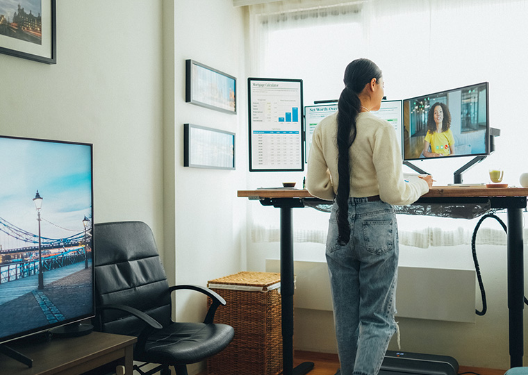 Woman working from home at standing desk