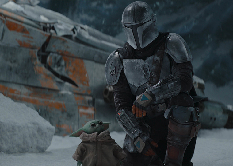 Grogu and The Mandalorian in a still from the Disney+ show.