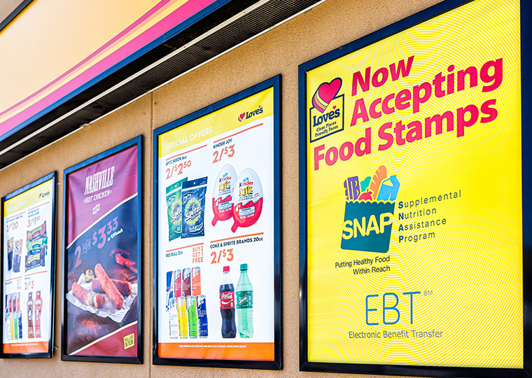 Love's gas station and sign on building exterior entrance in Missouri with convenience store closeup for food stamps.