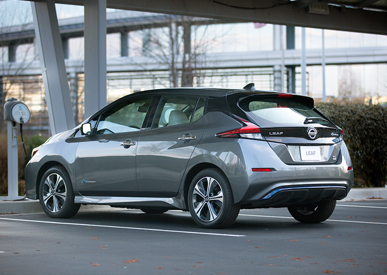 A Nissan Leaf at a charging station.