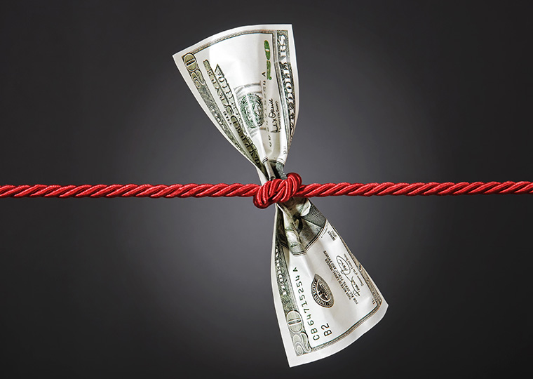 Tug of war with a $20 bill in the middle on gradient background