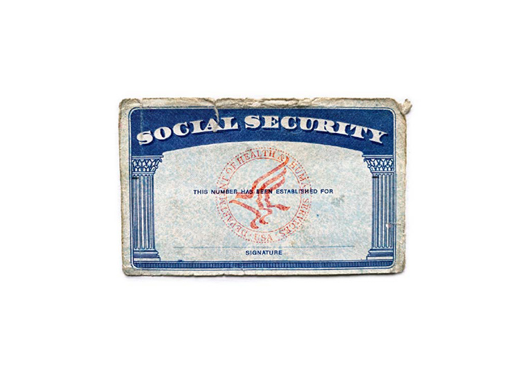 Blank faded social security card on white background top view