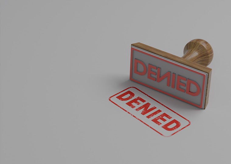 Denied rubber stamp on white background.