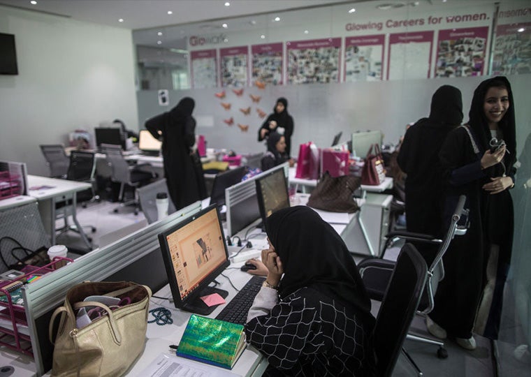 Saudi Arabian women working in an office.